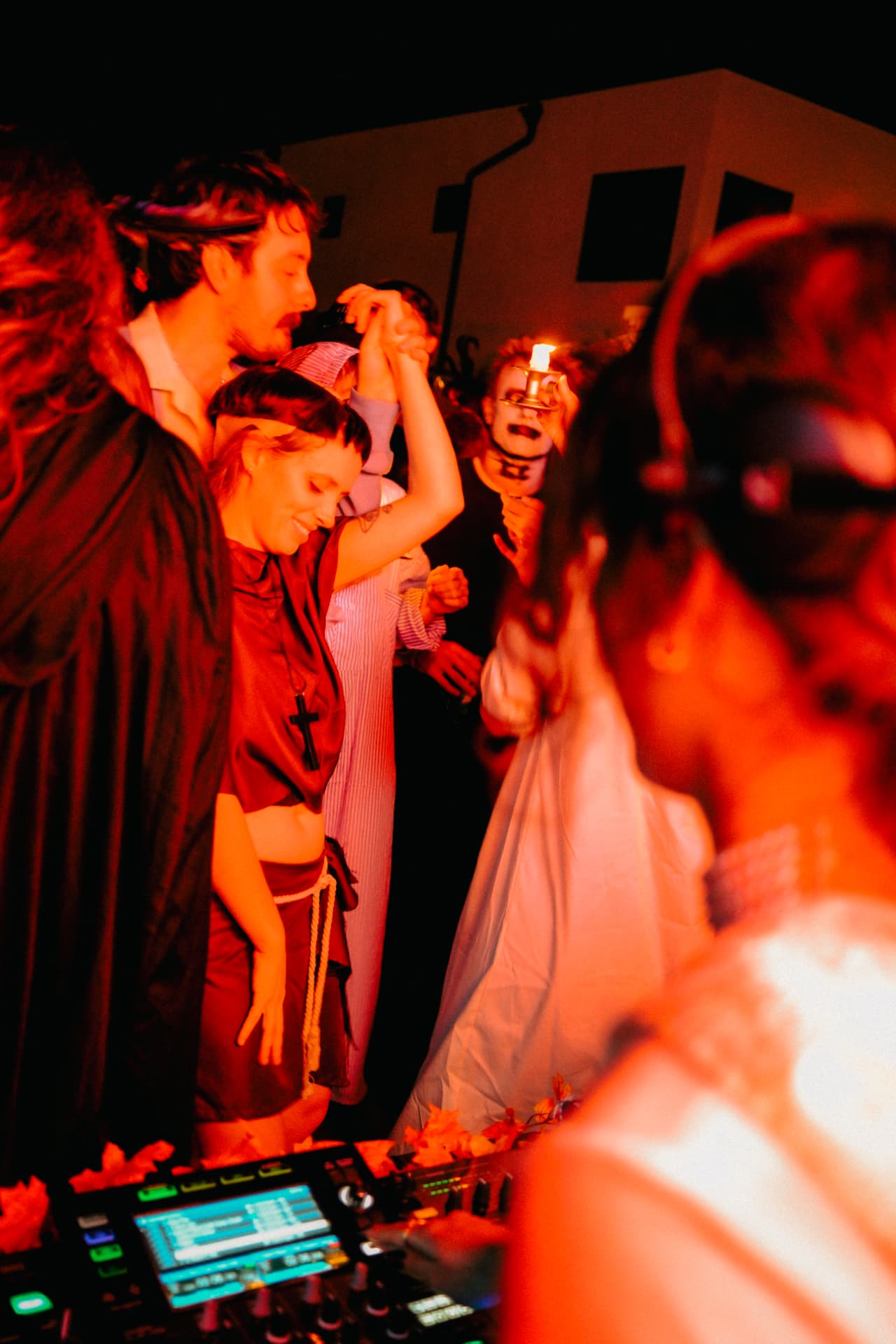 Crowd in costume dancing at a Melody.MP3 Halloween set