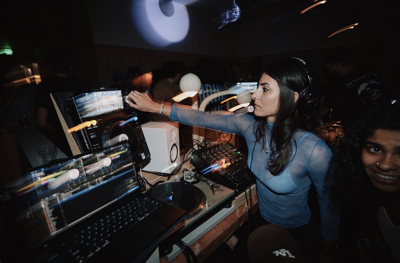Melody.MP3 in a Los Angeles club booth with motion blur